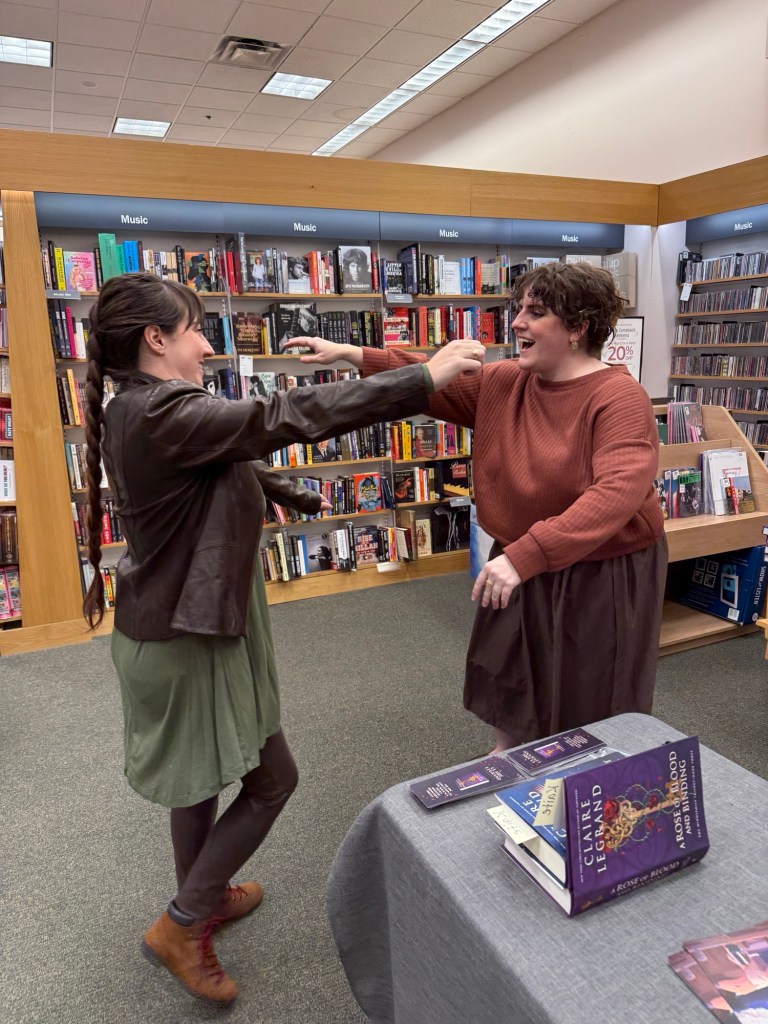 Kaite and Claire going in for a hug